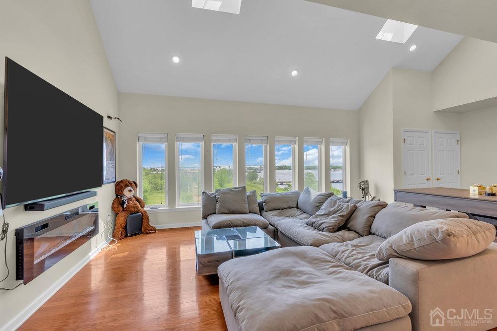 368 Rector Street, Unit 508 Perth Amboy, NJ 08861 - Photo 3 of 34 a living room with furniture and a flat screen tv