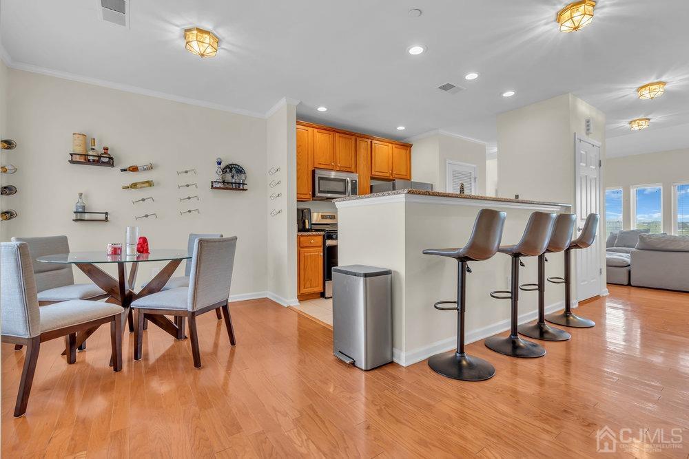 368 Rector Street, Unit 508 Perth Amboy, NJ 08861 - Photo 31 of 34 a dining room with furniture and wooden floor