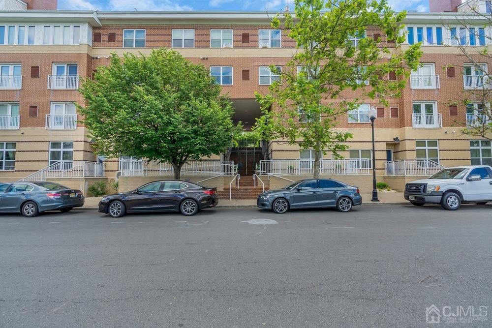 368 Rector Street, Unit 508 Perth Amboy, NJ 08861 - Photo 33 of 34 a view of a cars parked in front of a building