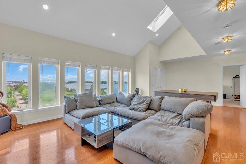 368 Rector Street, Unit 508 Perth Amboy, NJ 08861 - Photo 5 of 34 a living room with furniture and a large window