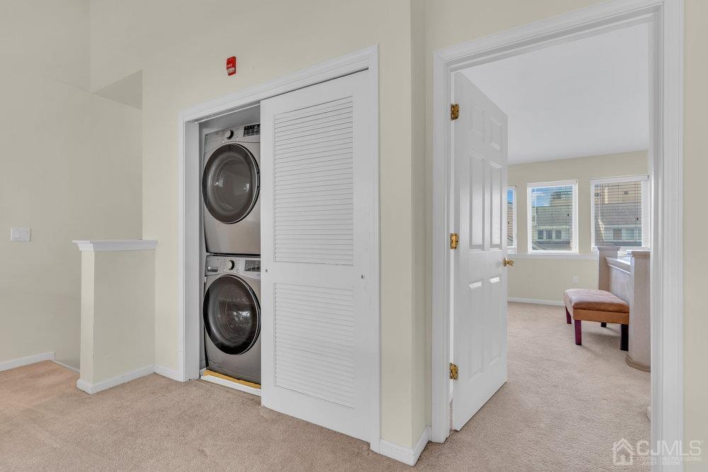 368 Rector Street, Unit 508 Perth Amboy, NJ 08861 - Photo 10 of 34 a view of a hallway with washer and dryer