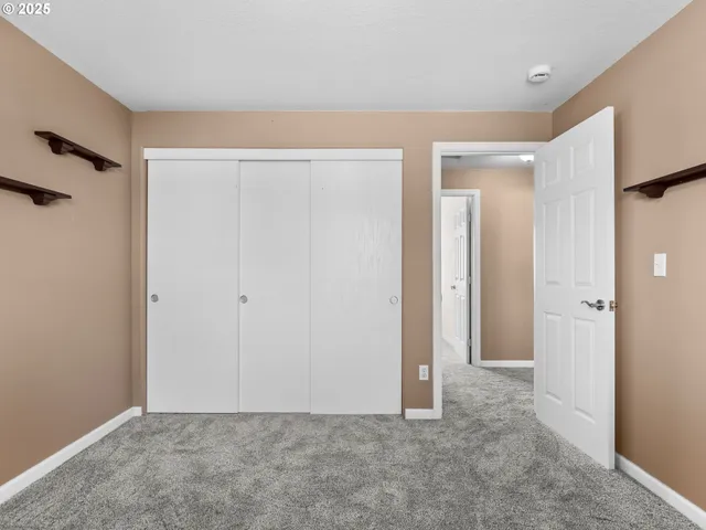 a en suite bathroom with a sink a mirror and a shower