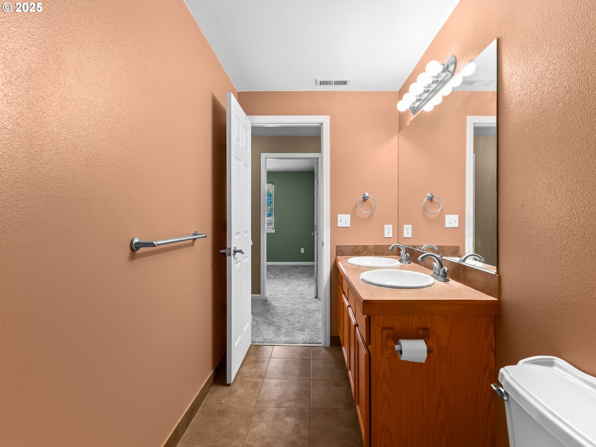 52407 Northeast 14th Scappoose, OR 97056 - Photo 33 of 46 a en suite bathroom with a sink a mirror and a shower