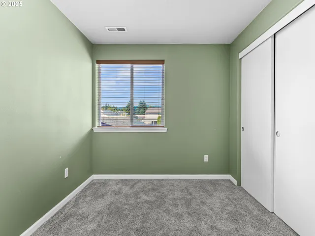a patio with wooden floors and outdoor seating