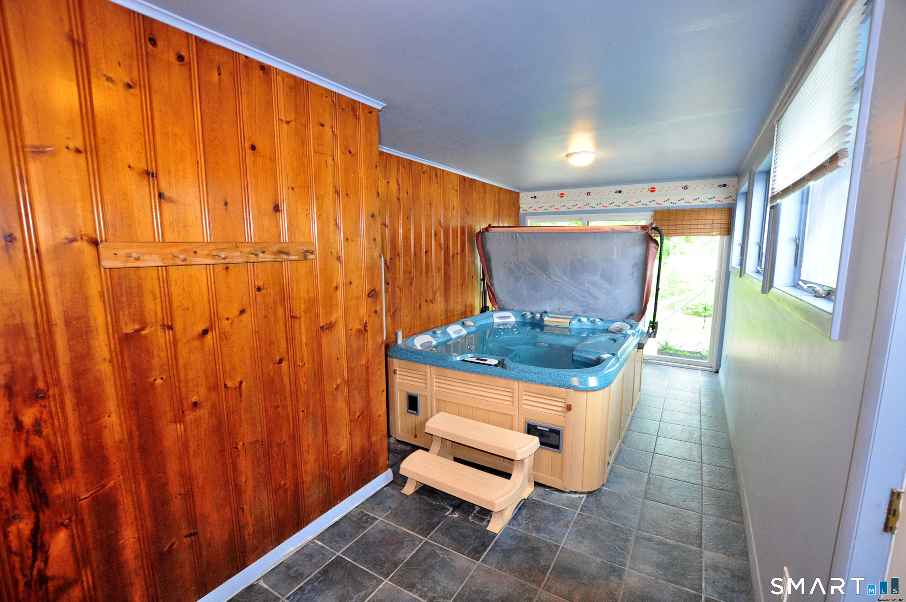 44 Miamis Road West Hartford, CT 06117 - Photo 20 of 39 a living room with a wooden floor and a table