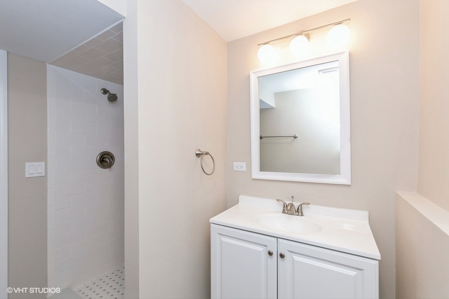 560 Linden Road Frankfort, IL 60423 - Photo 11 of 15 a bathroom with a sink a toilet and mirror
