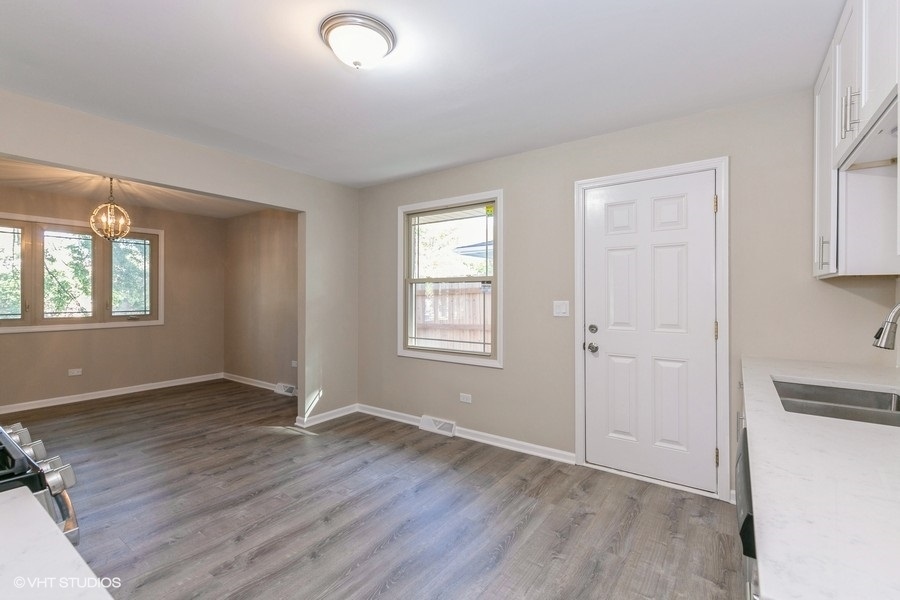 560 Linden Road Frankfort, IL 60423 - Photo 6 of 15 an empty room with wooden floor and windows