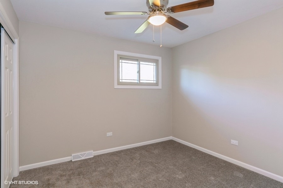 560 Linden Road Frankfort, IL 60423 - Photo 7 of 15 an empty room with a window and a fan