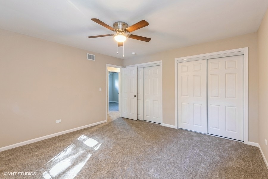 560 Linden Road Frankfort, IL 60423 - Photo 9 of 15 an empty room with closet and fan