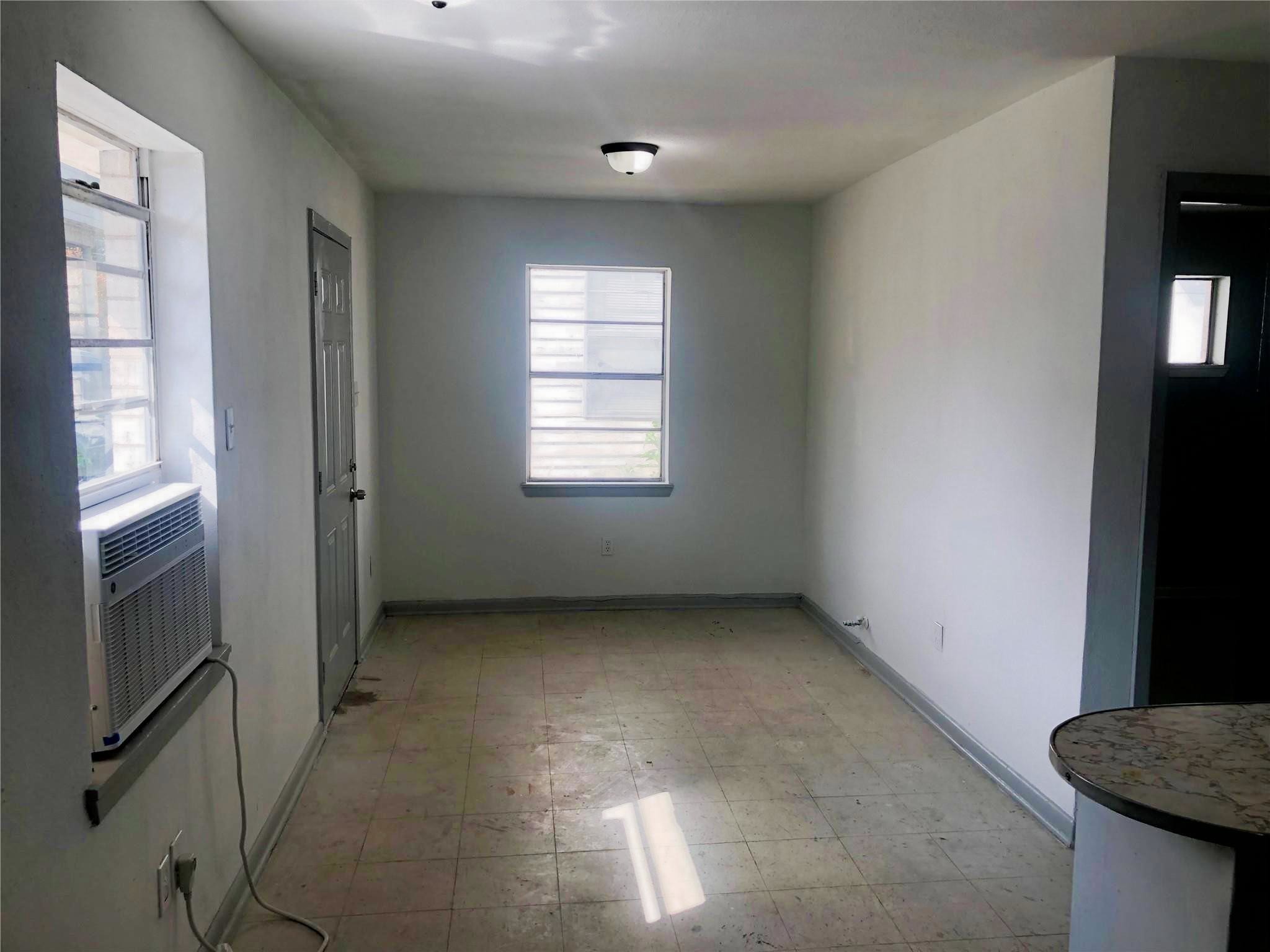 404 James Houston, TX 77009 - Photo 5 of 11 a view of an empty room with a window