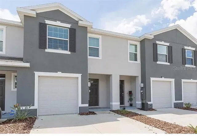 a front view of a house with a lots of windows