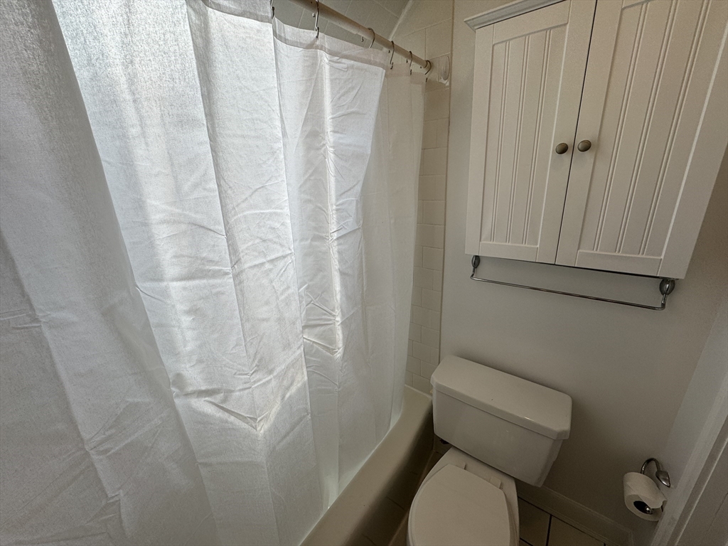 24 Ellington Road, Unit 3 Somerville, MA 02144 - Photo 11 of 21 a white toilet sitting next to a shower