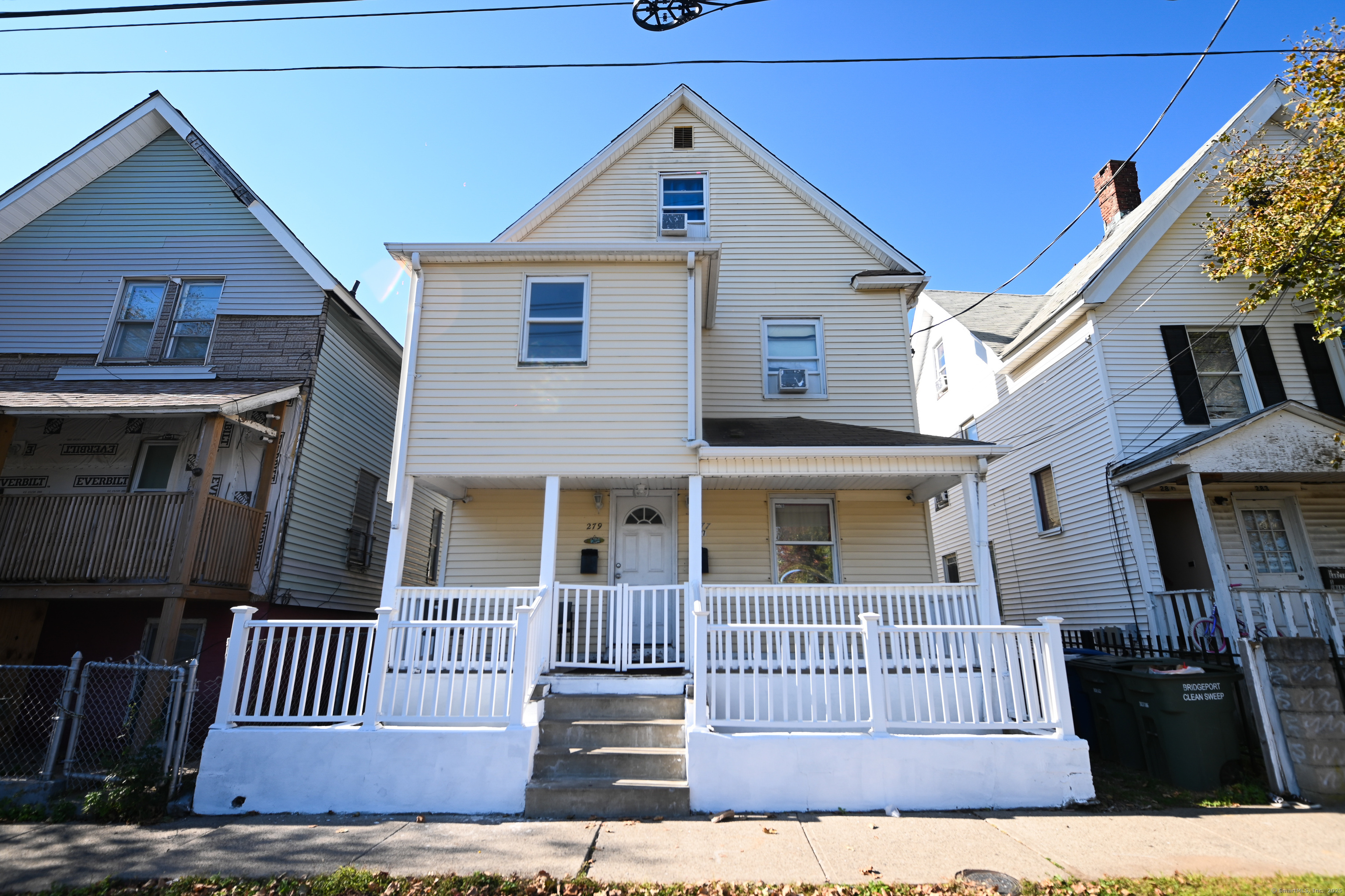 277 Helen Street Bridgeport, CT 06608 - Photo 1 of 19 a view of a house with a yard