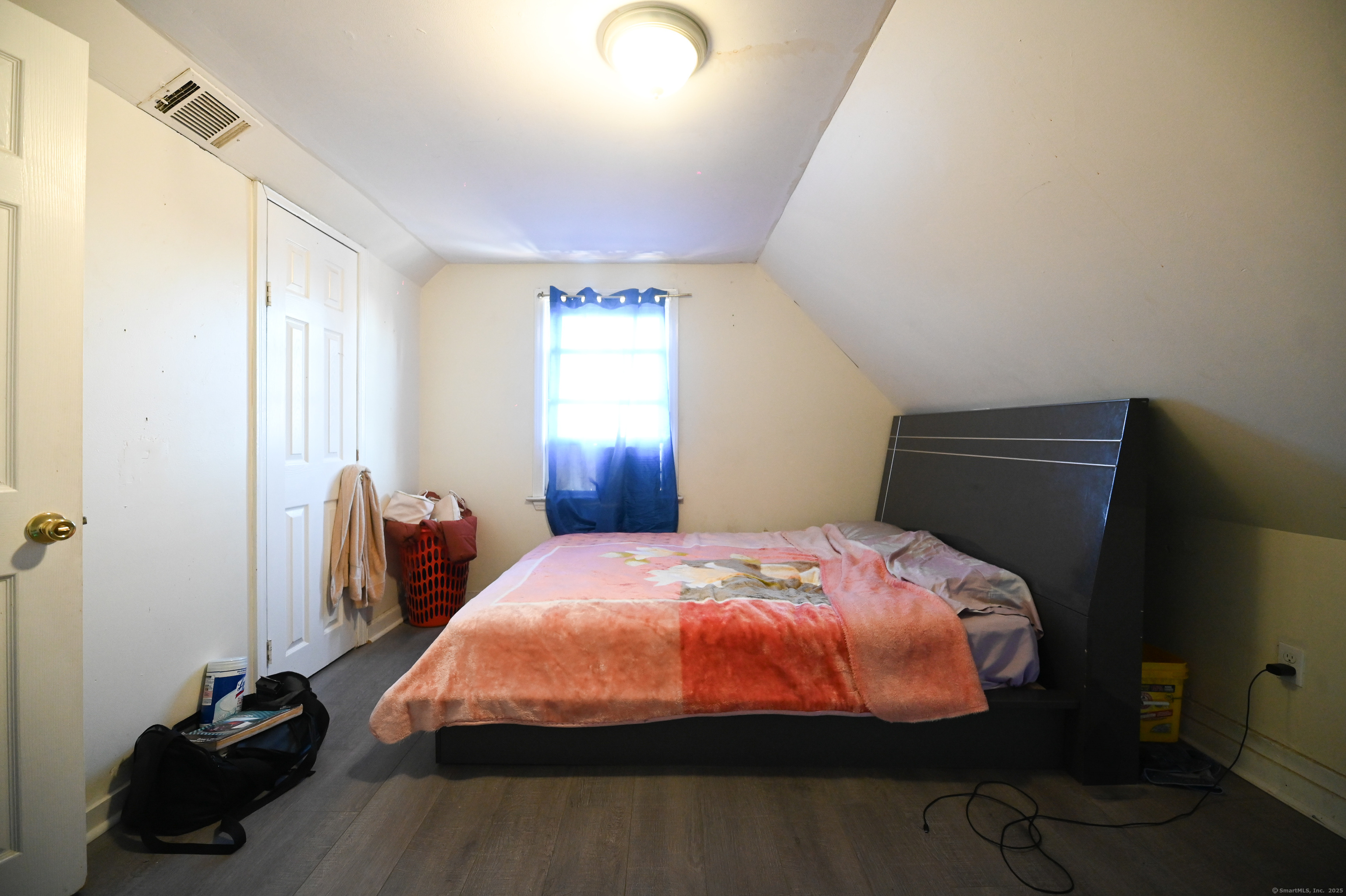 277 Helen Street Bridgeport, CT 06608 - Photo 11 of 19 a bedroom with a bed and a closet