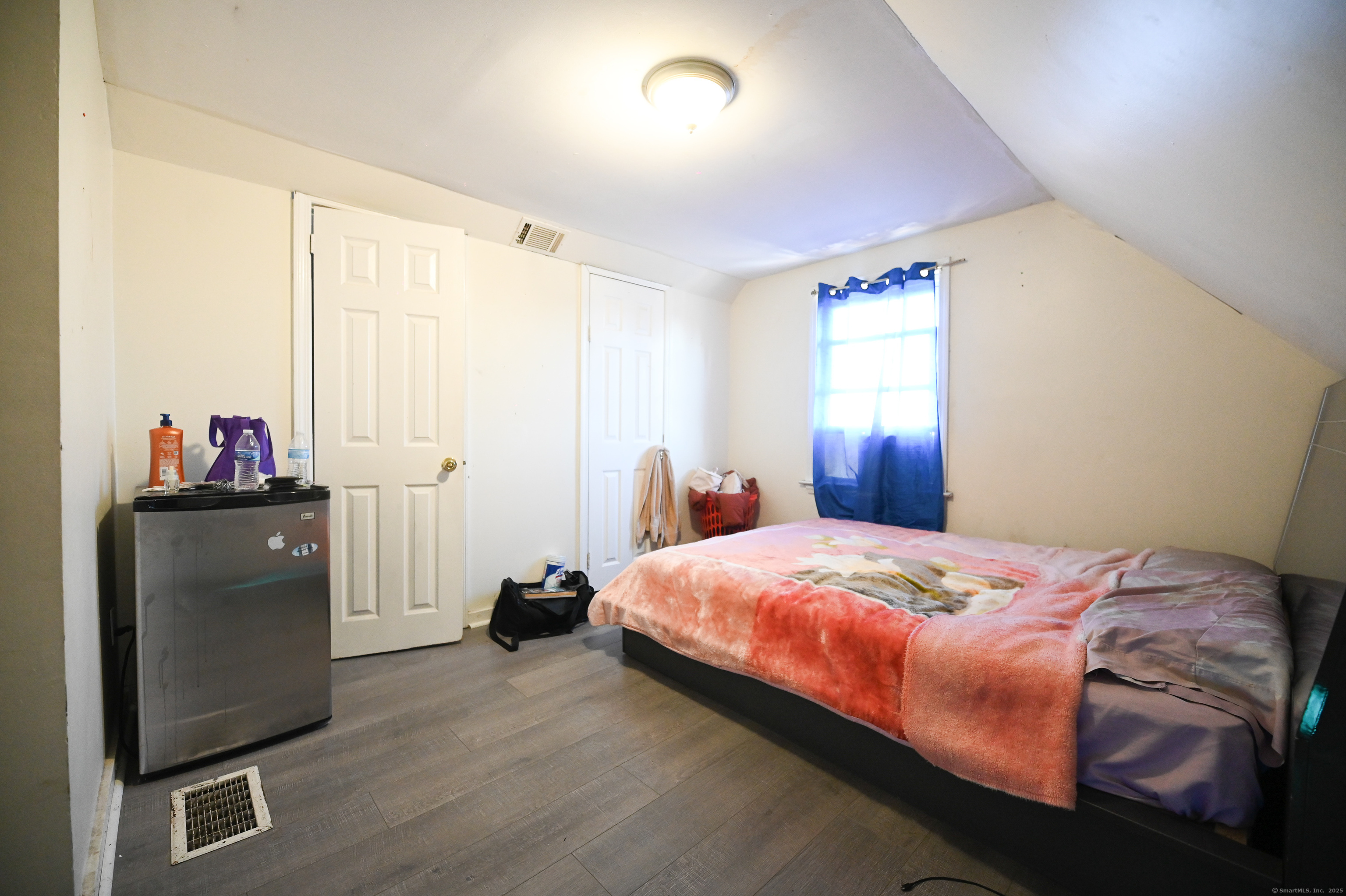 277 Helen Street Bridgeport, CT 06608 - Photo 13 of 19 a bedroom with a bed and a window