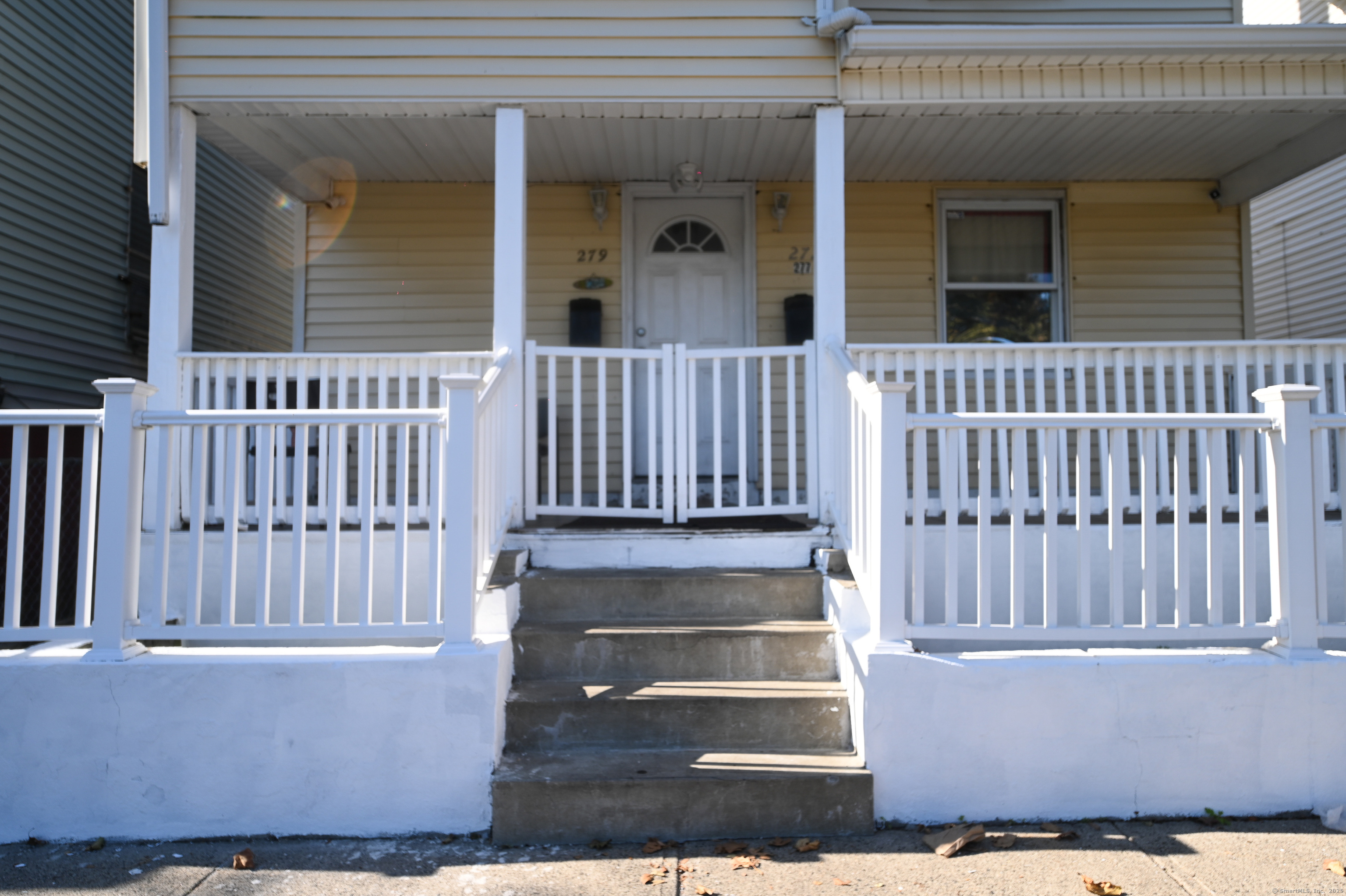 277 Helen Street Bridgeport, CT 06608 - Photo 4 of 19 a view of a house with a deck