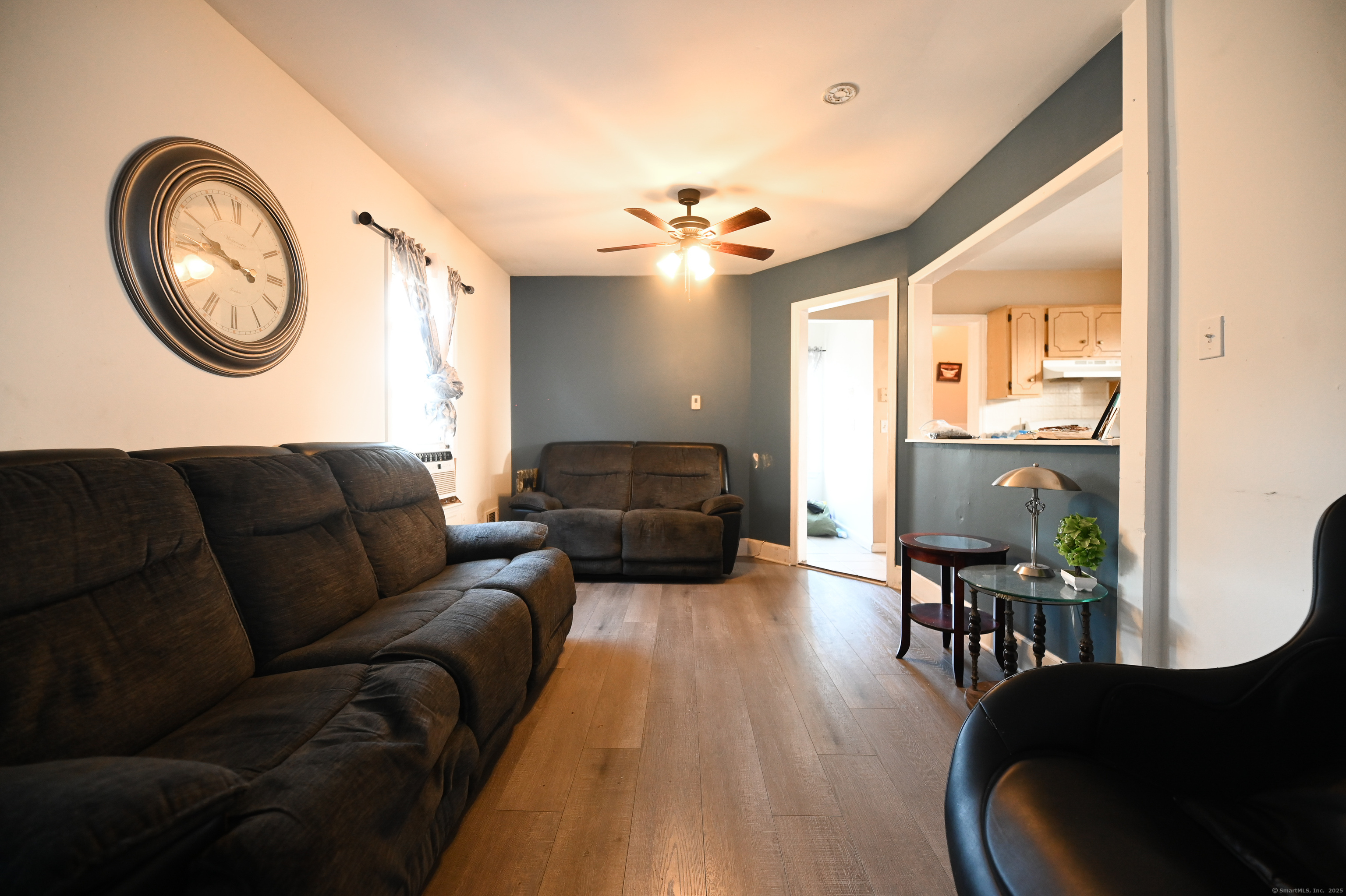 277 Helen Street Bridgeport, CT 06608 - Photo 6 of 19 a living room with furniture and a large window