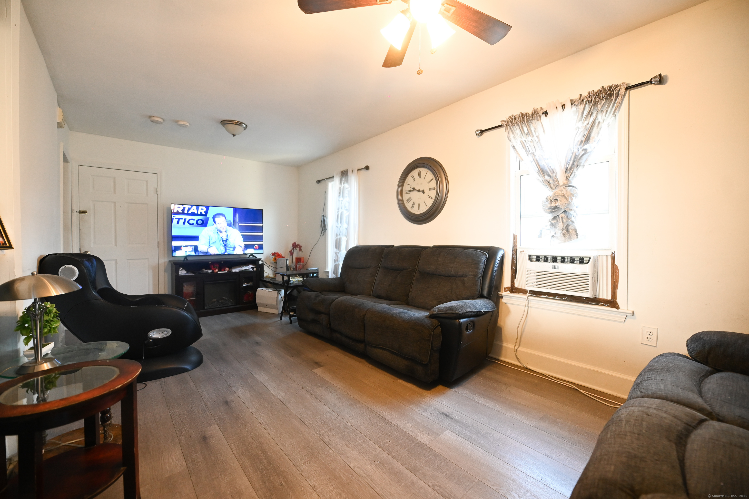 277 Helen Street Bridgeport, CT 06608 - Photo 7 of 19 a living room with furniture and a window