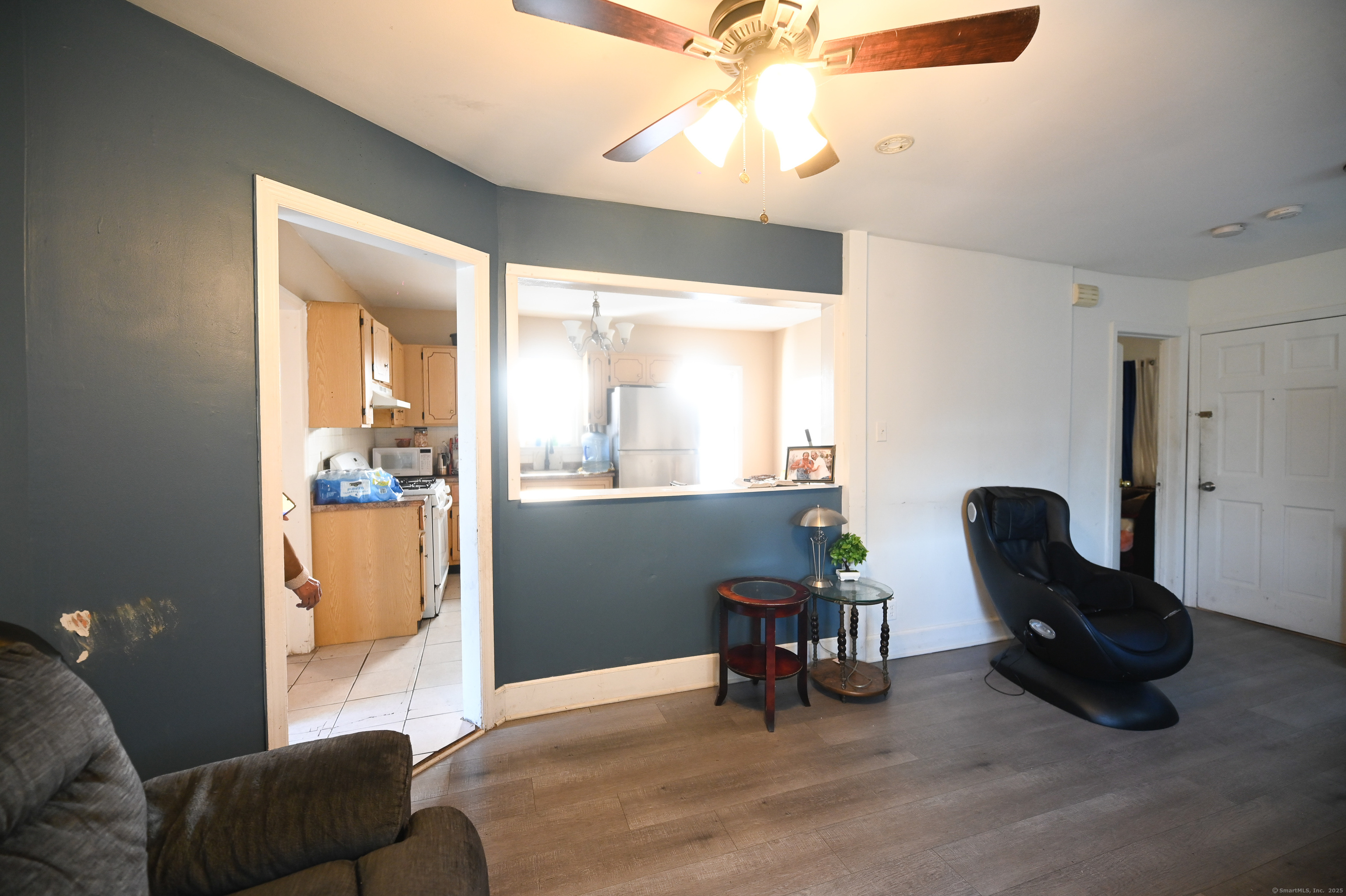 277 Helen Street Bridgeport, CT 06608 - Photo 8 of 19 a living room with furniture and a chandelier