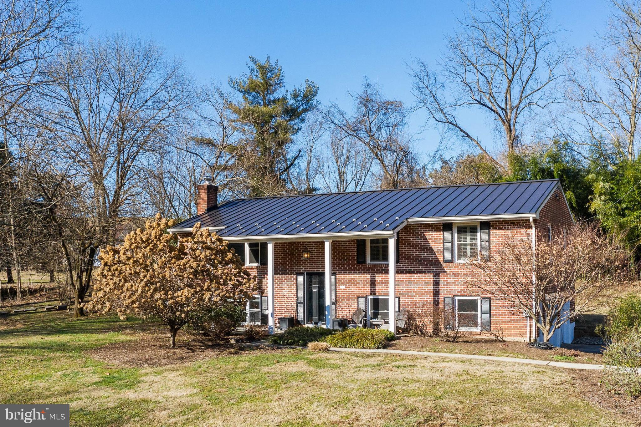 1973 Kimberton Road Phoenixville, PA 19460 - Photo 2 of 28 Brick home with newer metal roof and gutters
