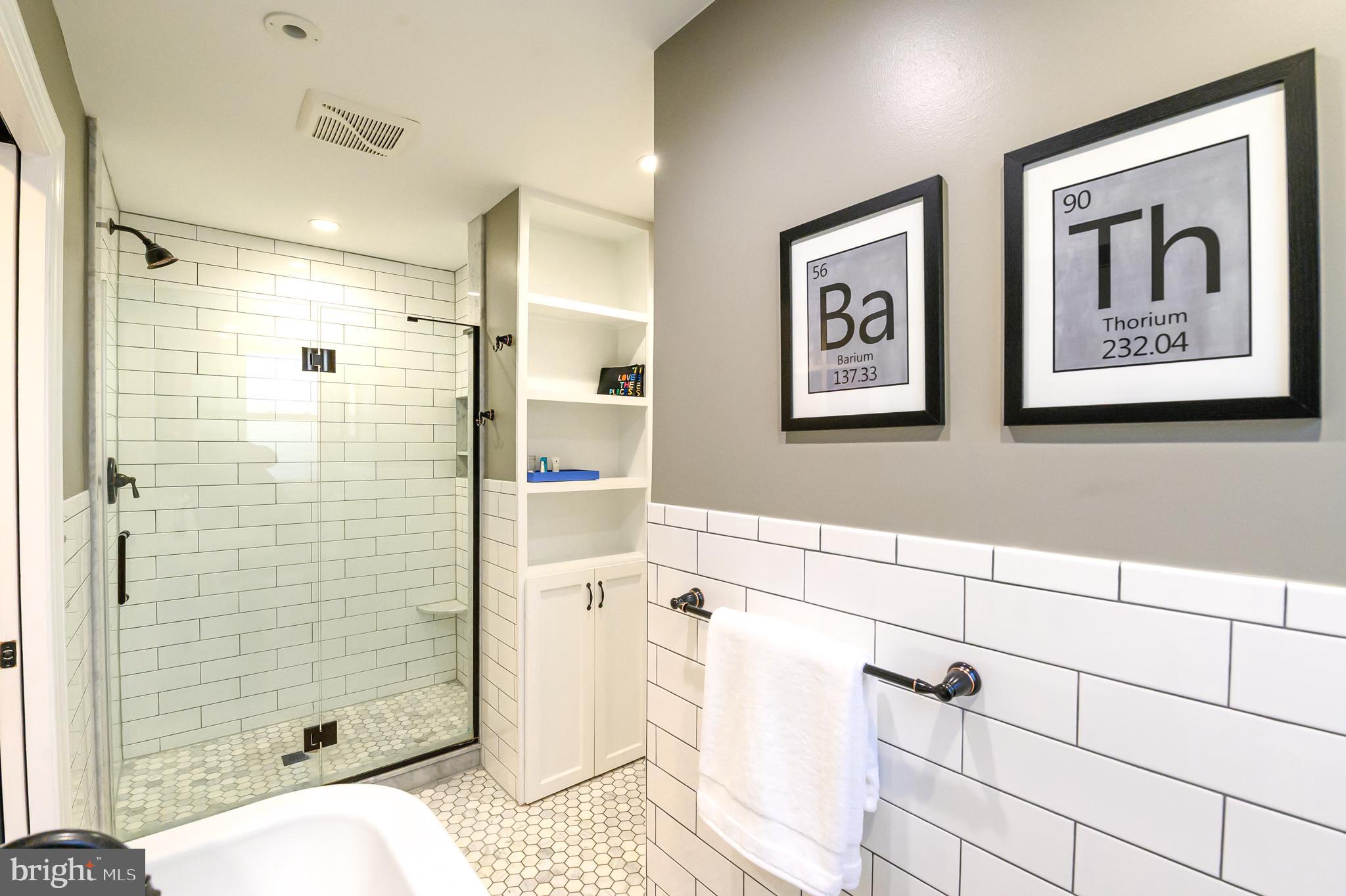 1973 Kimberton Road Phoenixville, PA 19460 - Photo 24 of 28 Marble tile, frameless shower, built-in storage