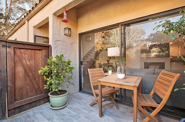 a outdoor dining space with furniture and a potted plant