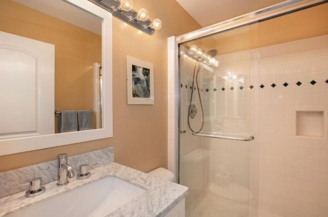 a bathroom with a sink and shower