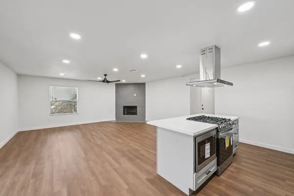 a view of kitchen with sink and wooden floor