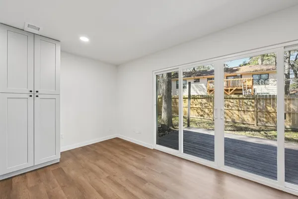 a kitchen with a sink a stove and cabinets