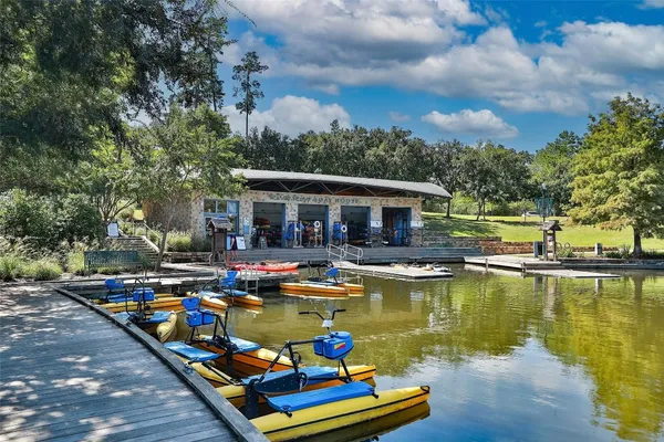 swimming pool view with a seating space