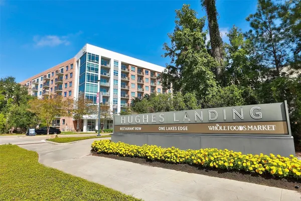 a view of swimming pool with outdoor seating and lake view
