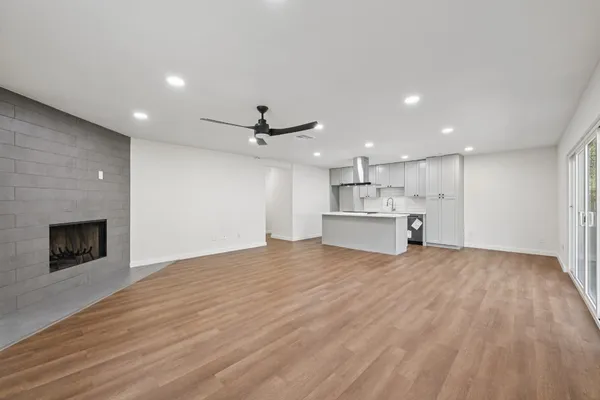 a view of kitchen with wooden floor and window