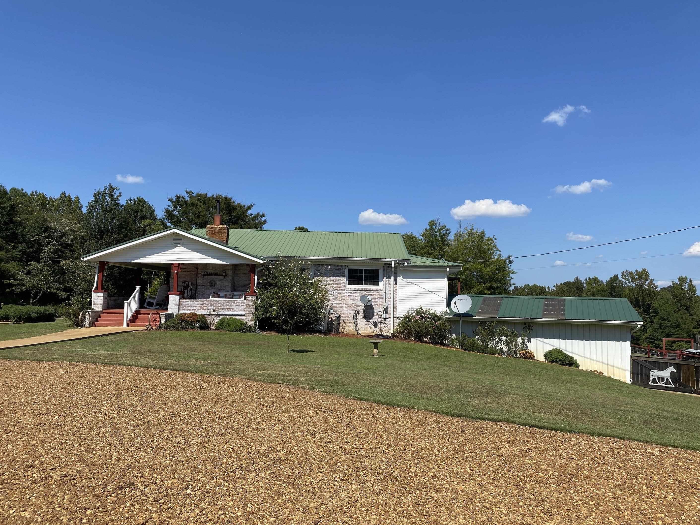 90 Dickson Road Sardis, TN 38371 - Photo 2 of 25 a view of a house with a yard