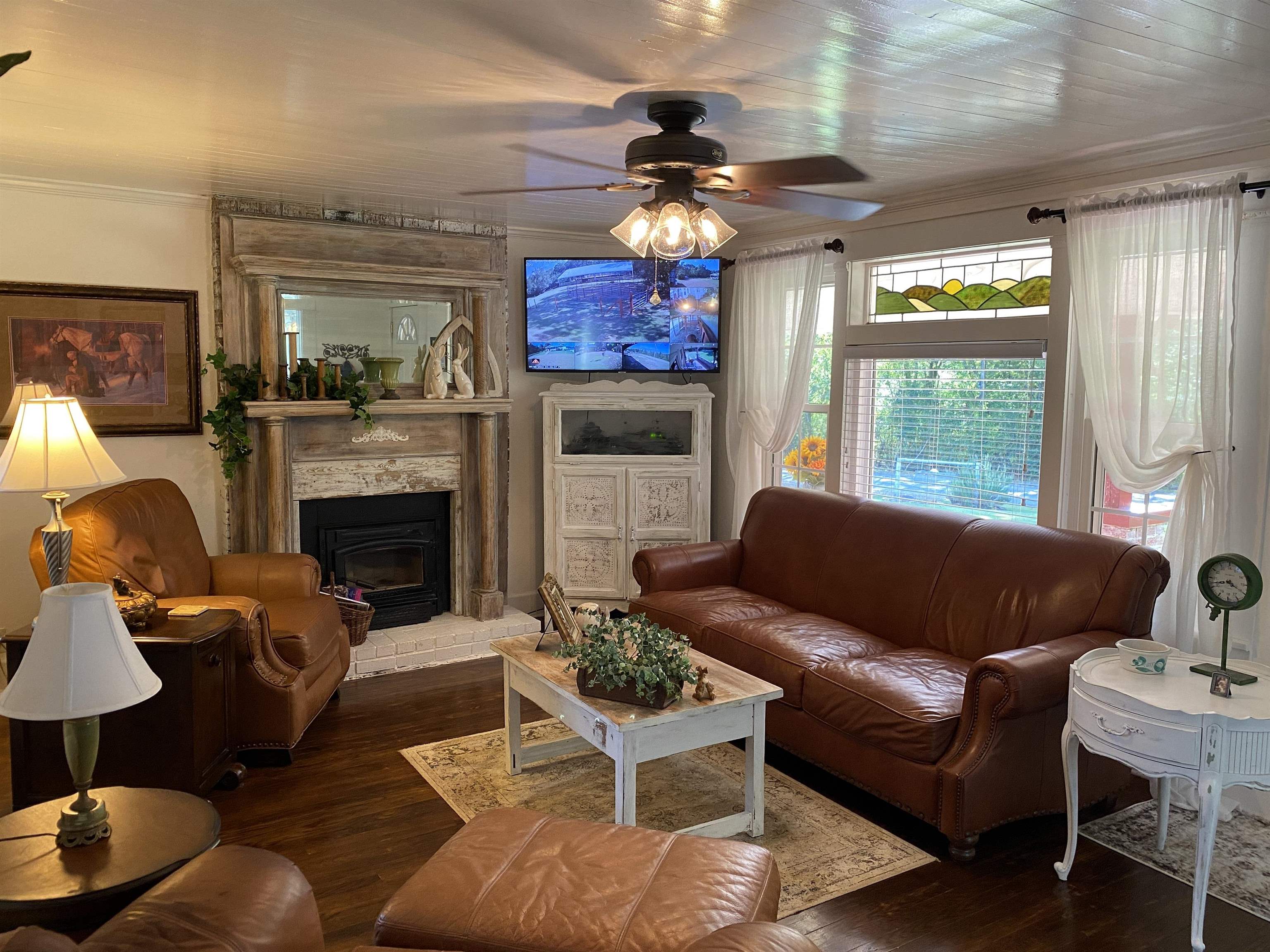 90 Dickson Road Sardis, TN 38371 - Photo 8 of 25 a living room with furniture a fireplace and a large window