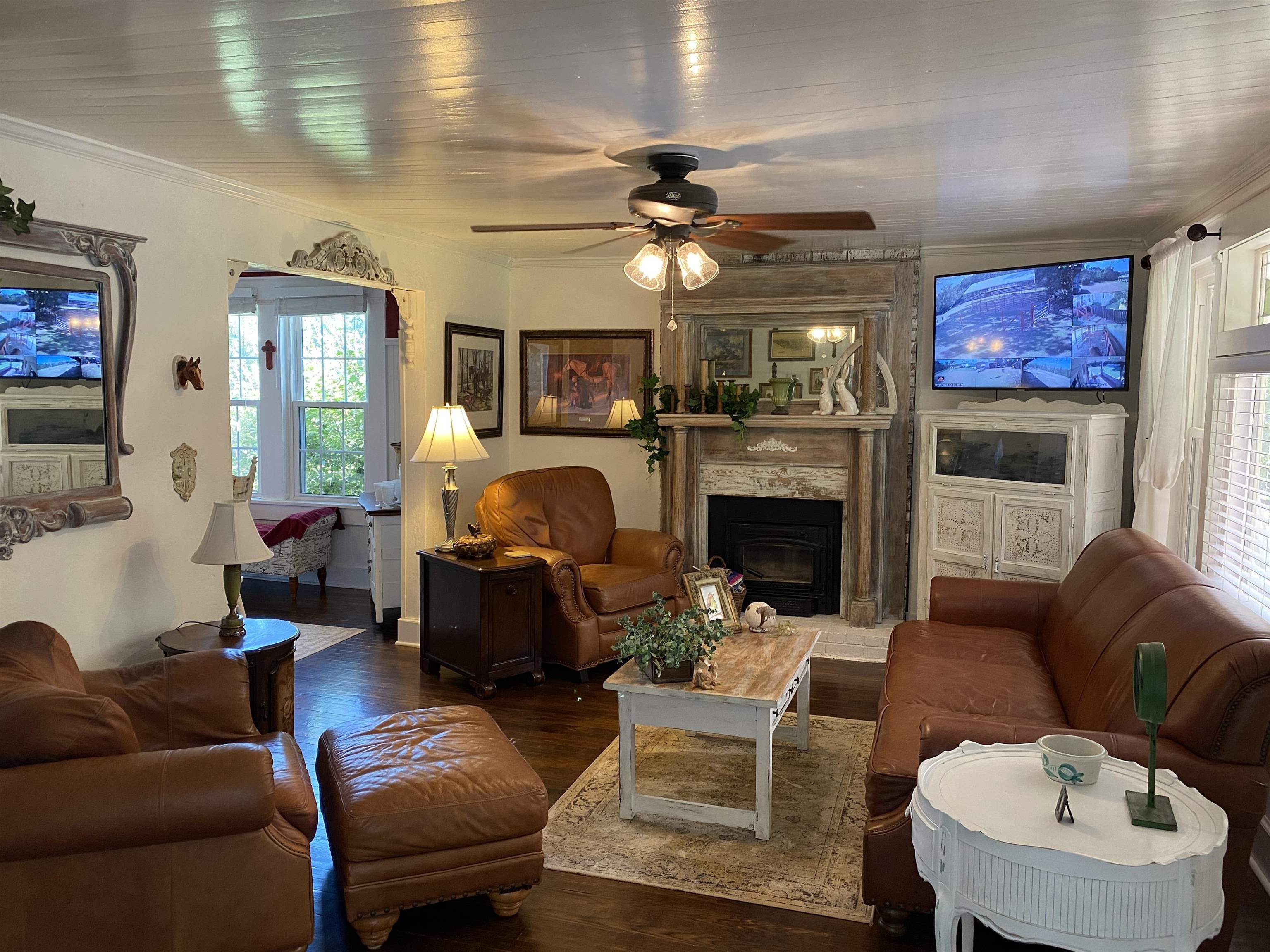 90 Dickson Road Sardis, TN 38371 - Photo 9 of 25 a living room with furniture a fireplace and a flat screen tv
