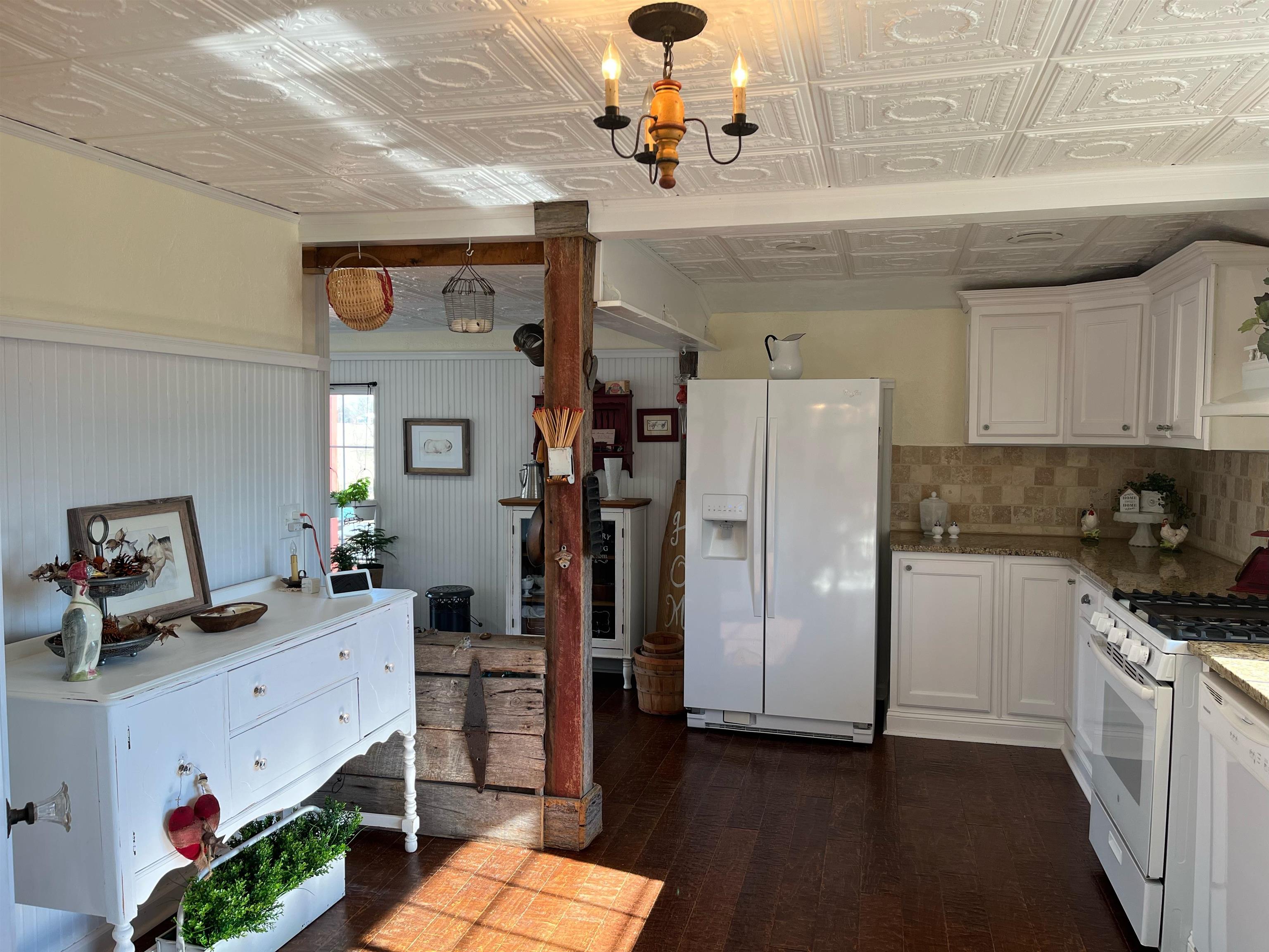 90 Dickson Road Sardis, TN 38371 - Photo 10 of 25 a kitchen with cabinets and wooden floor