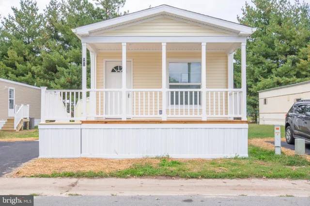 a front view of a house with a swimming pool