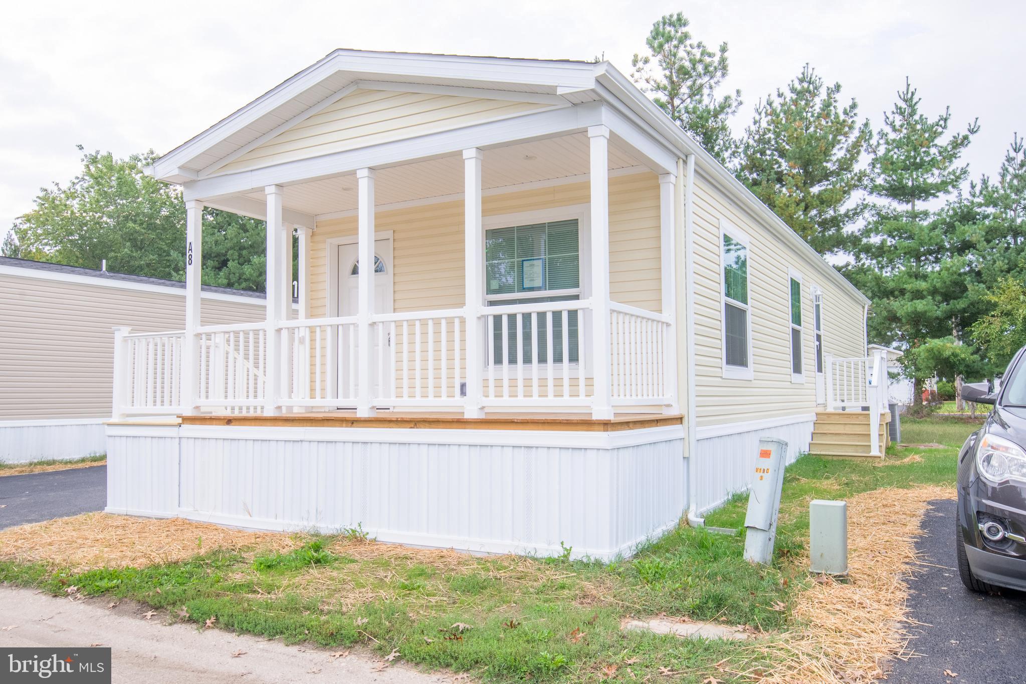 1679 South State Street, Unit A8 Dover, DE 19901 - Photo 3 of 19 a front view of a house with garden