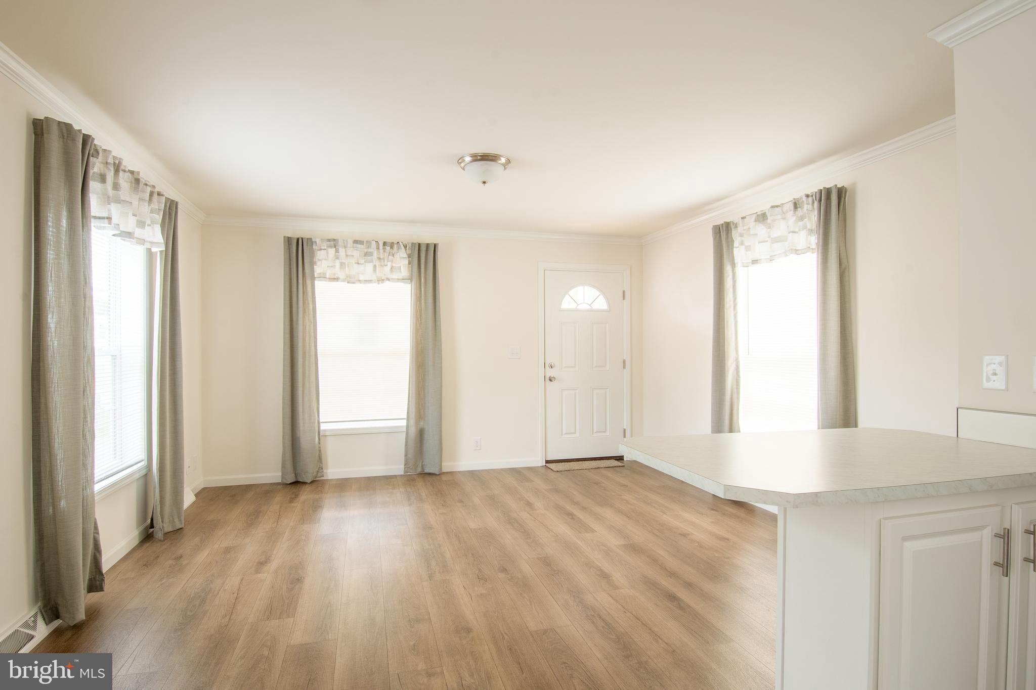 1679 South State Street, Unit A8 Dover, DE 19901 - Photo 9 of 19 a view of an empty room and window