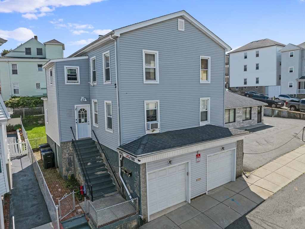 242 Washington Street Fall River, MA 02721 - Photo 1 of 23 a backyard of a house with wooden floor