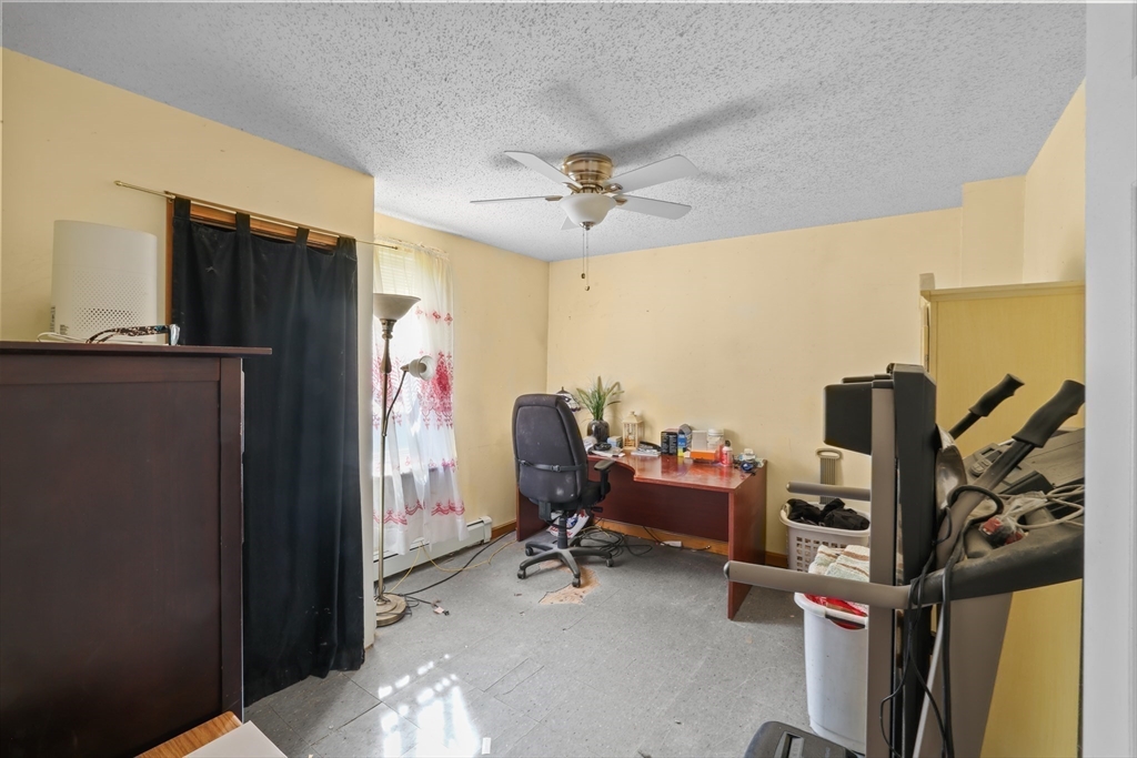 242 Washington Street Fall River, MA 02721 - Photo 17 of 23 a view of a workspace with furniture and a window