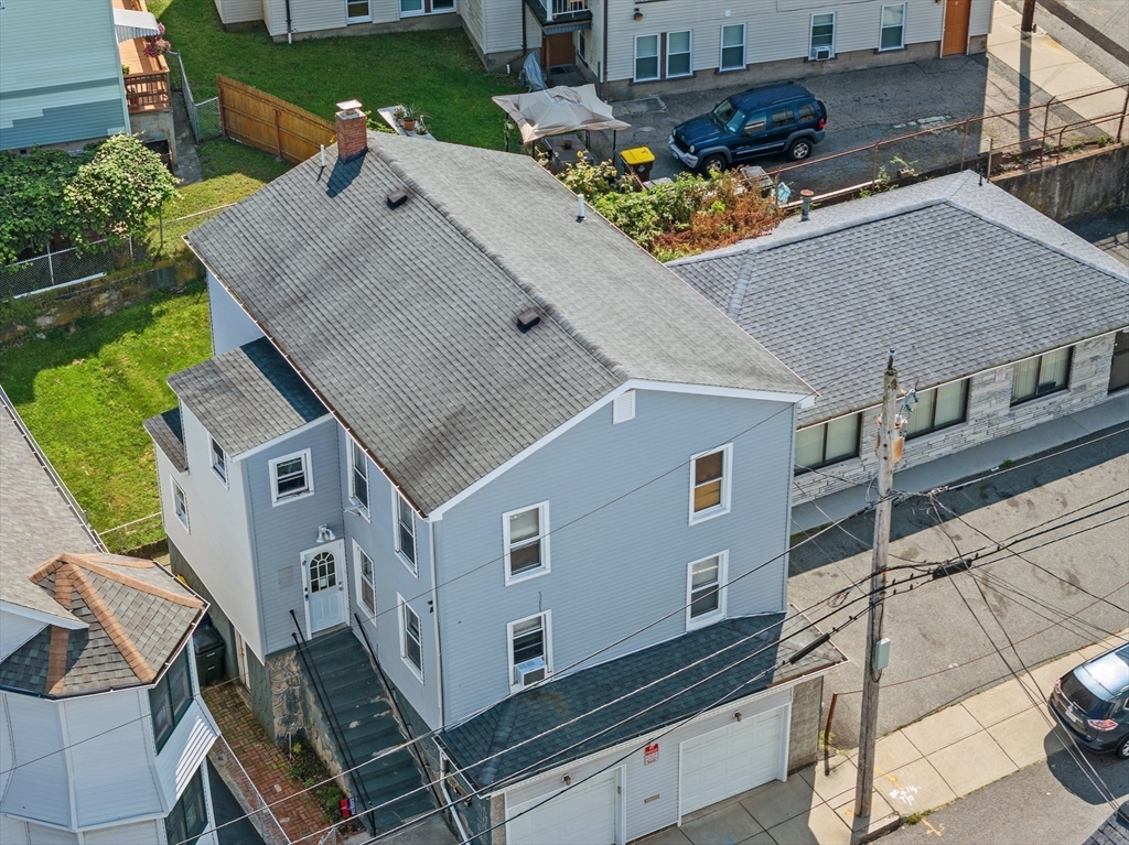 242 Washington Street Fall River, MA 02721 - Photo 3 of 23 a aerial view of a house with a yard