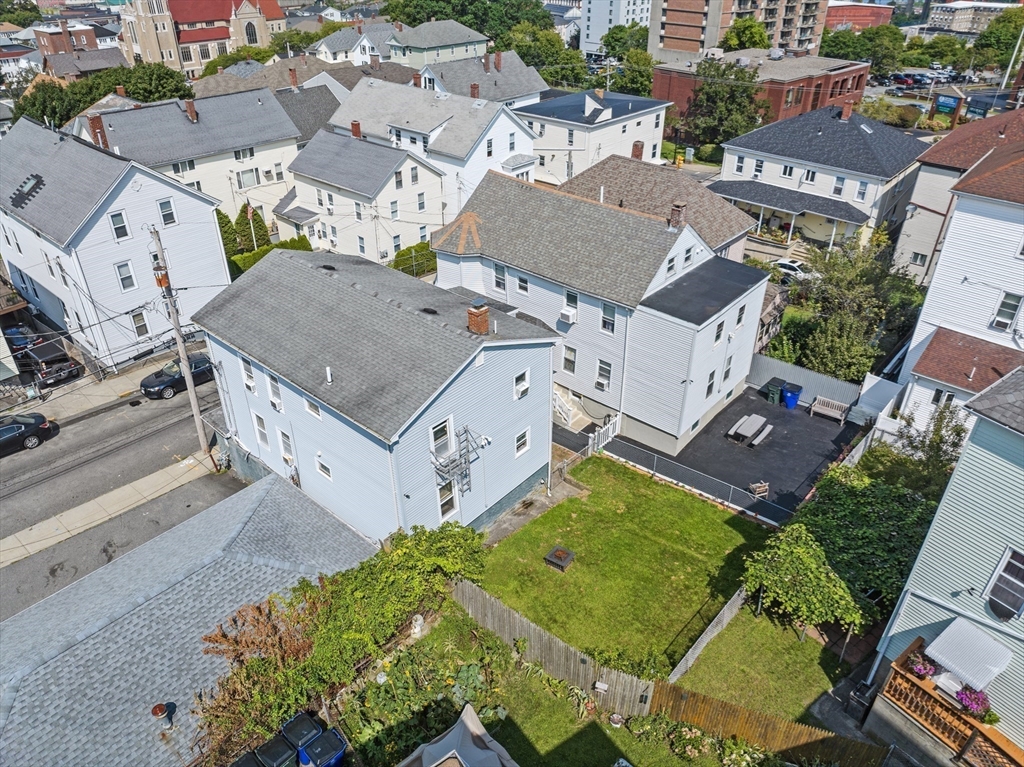 242 Washington Street Fall River, MA 02721 - Photo 5 of 23 an aerial view of a house with a garden and trees