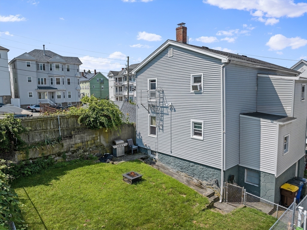 242 Washington Street Fall River, MA 02721 - Photo 7 of 23 a view of a house with backyard and garden