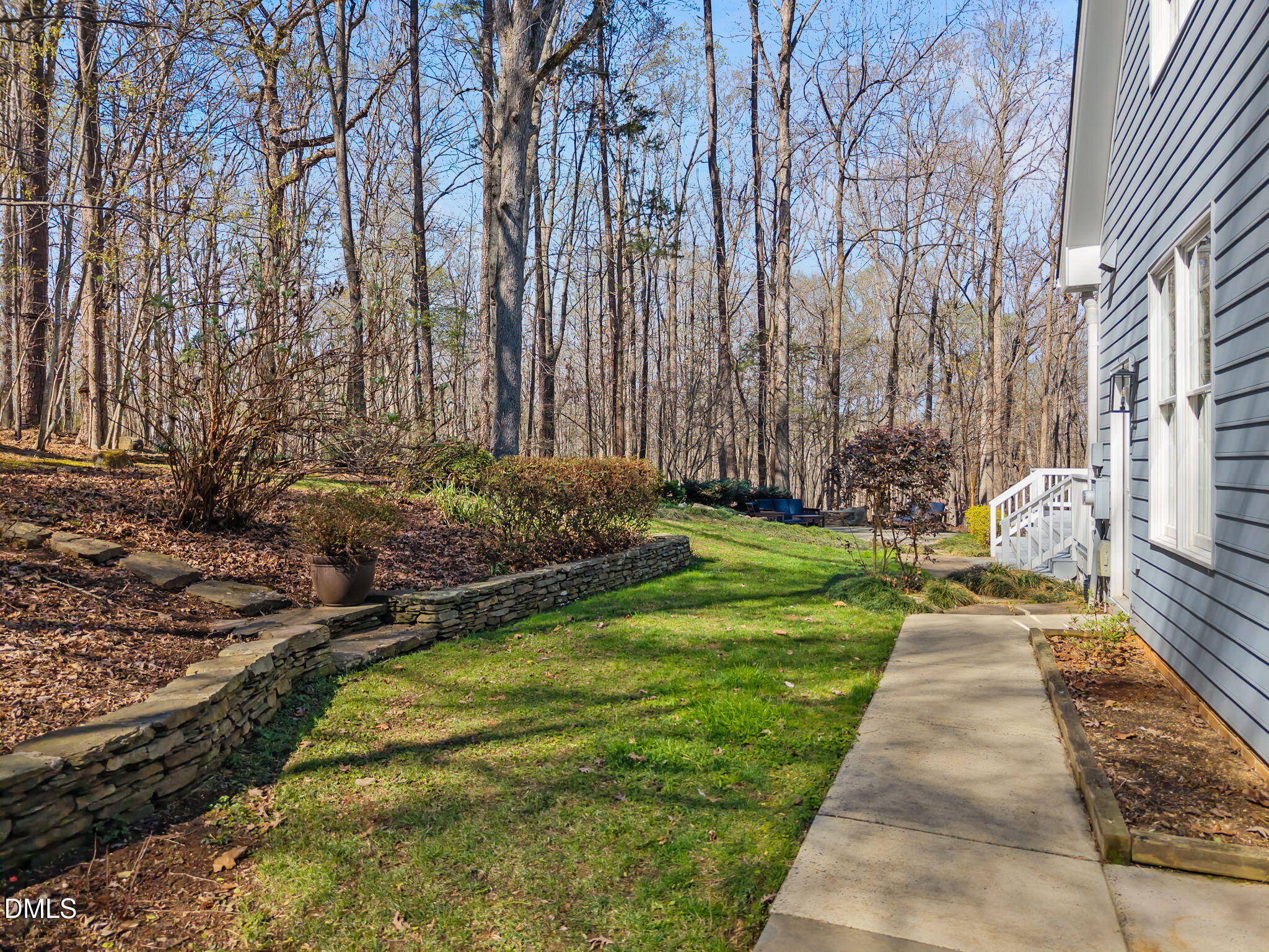 111 Lake Ridge Place Chapel Hill, NC 27516 - Photo 21 of 84 a backyard of a house with lots of green space