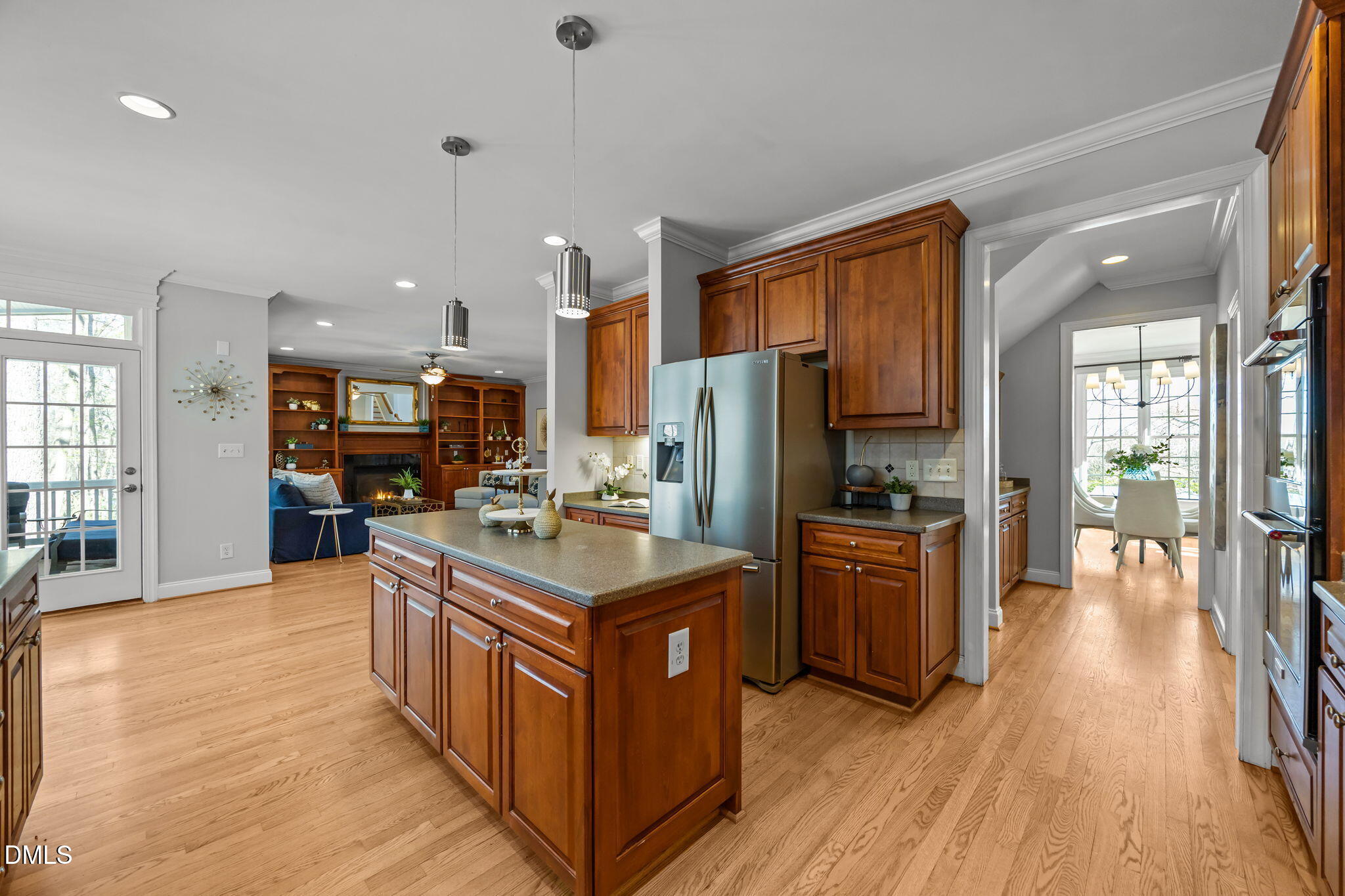 111 Lake Ridge Place Chapel Hill, NC 27516 - Photo 29 of 84 a kitchen with stainless steel appliances granite countertop a refrigerator a stove a sink dishwasher and a refrigerator with wooden floor