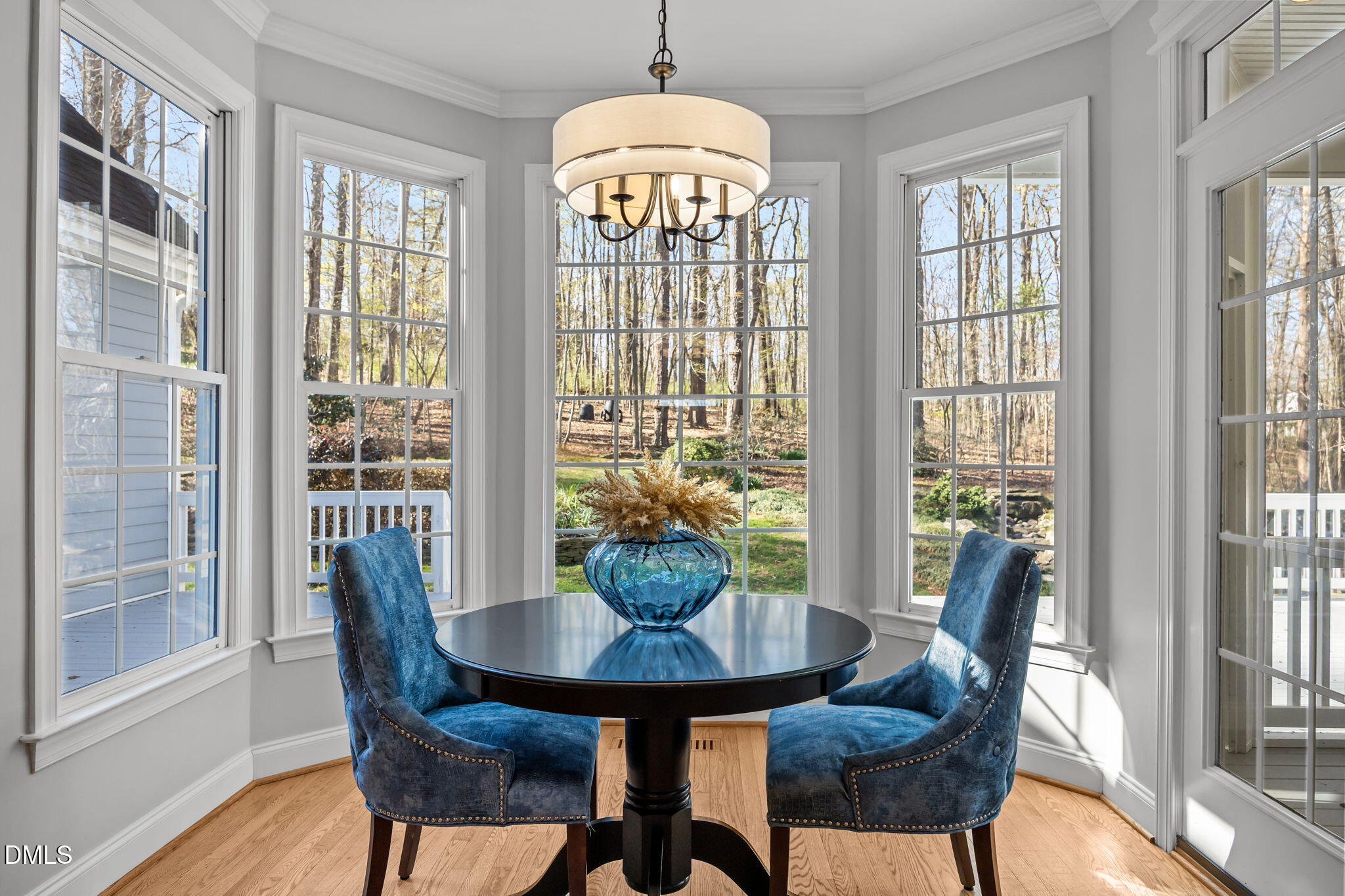111 Lake Ridge Place Chapel Hill, NC 27516 - Photo 31 of 84 a view of a dining room with furniture wooden floor and a chandelier