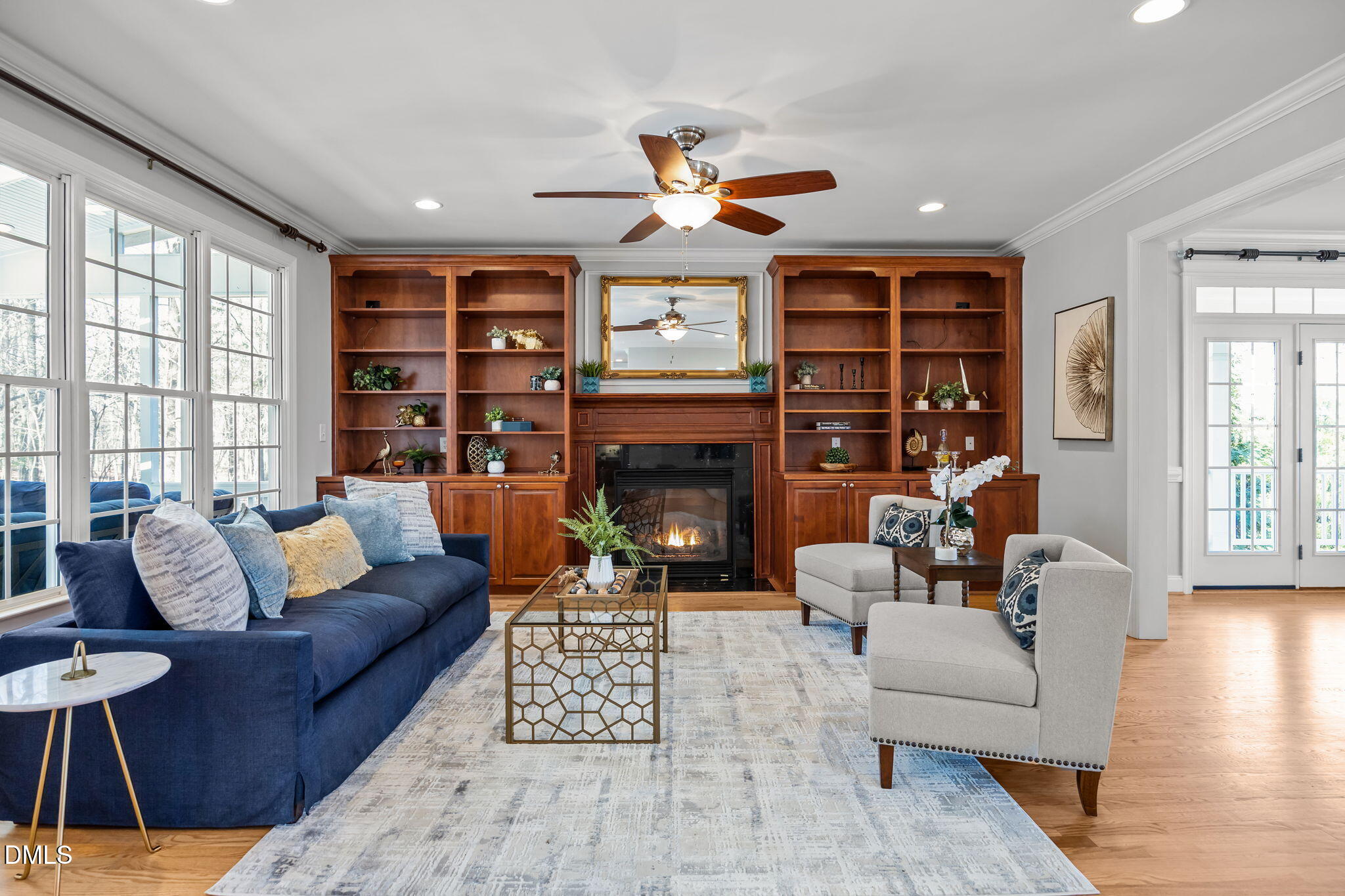 111 Lake Ridge Place Chapel Hill, NC 27516 - Photo 44 of 84 a living room with furniture a fireplace and a large window