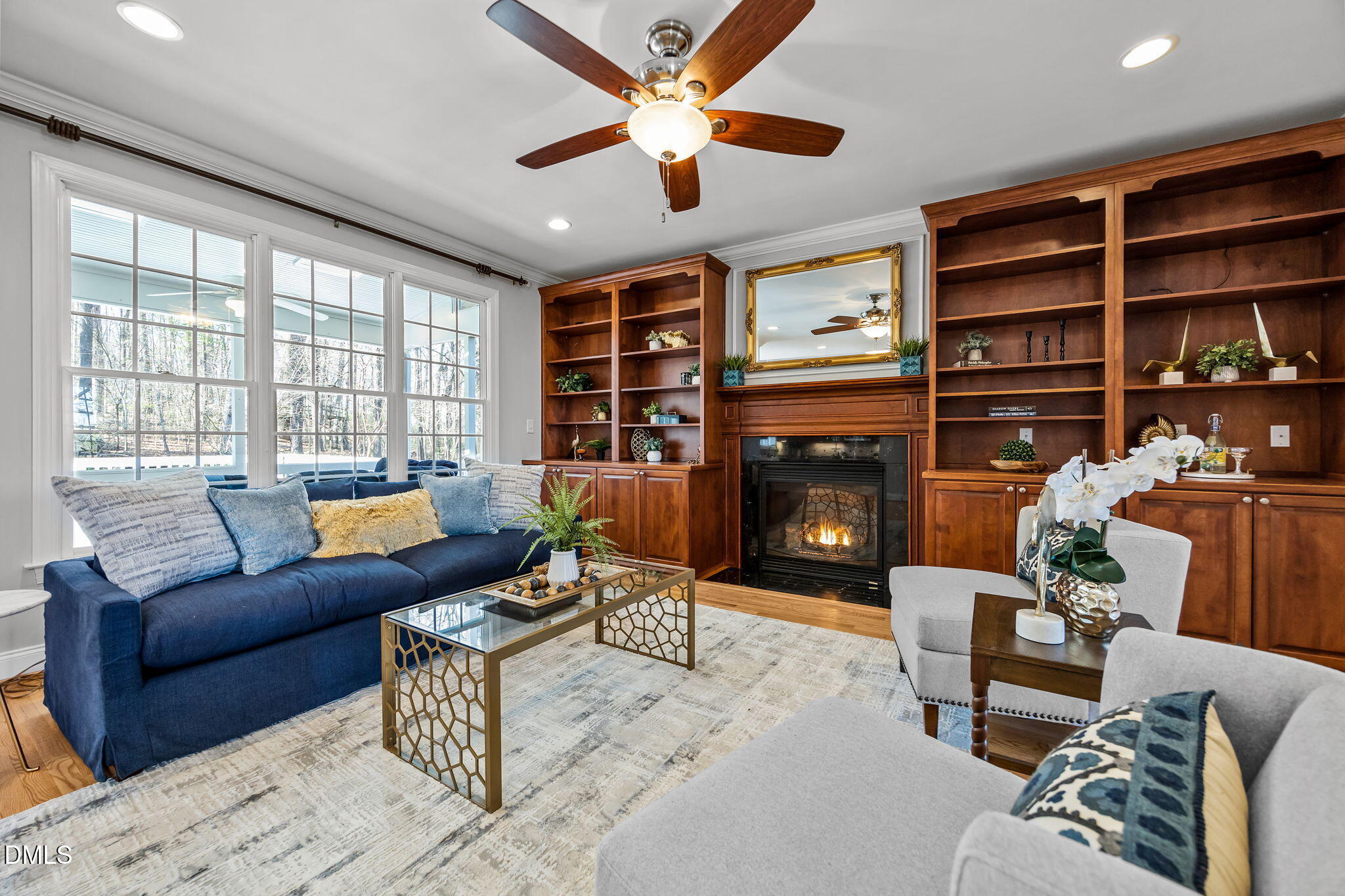 111 Lake Ridge Place Chapel Hill, NC 27516 - Photo 47 of 84 a living room with furniture a fireplace and a large window
