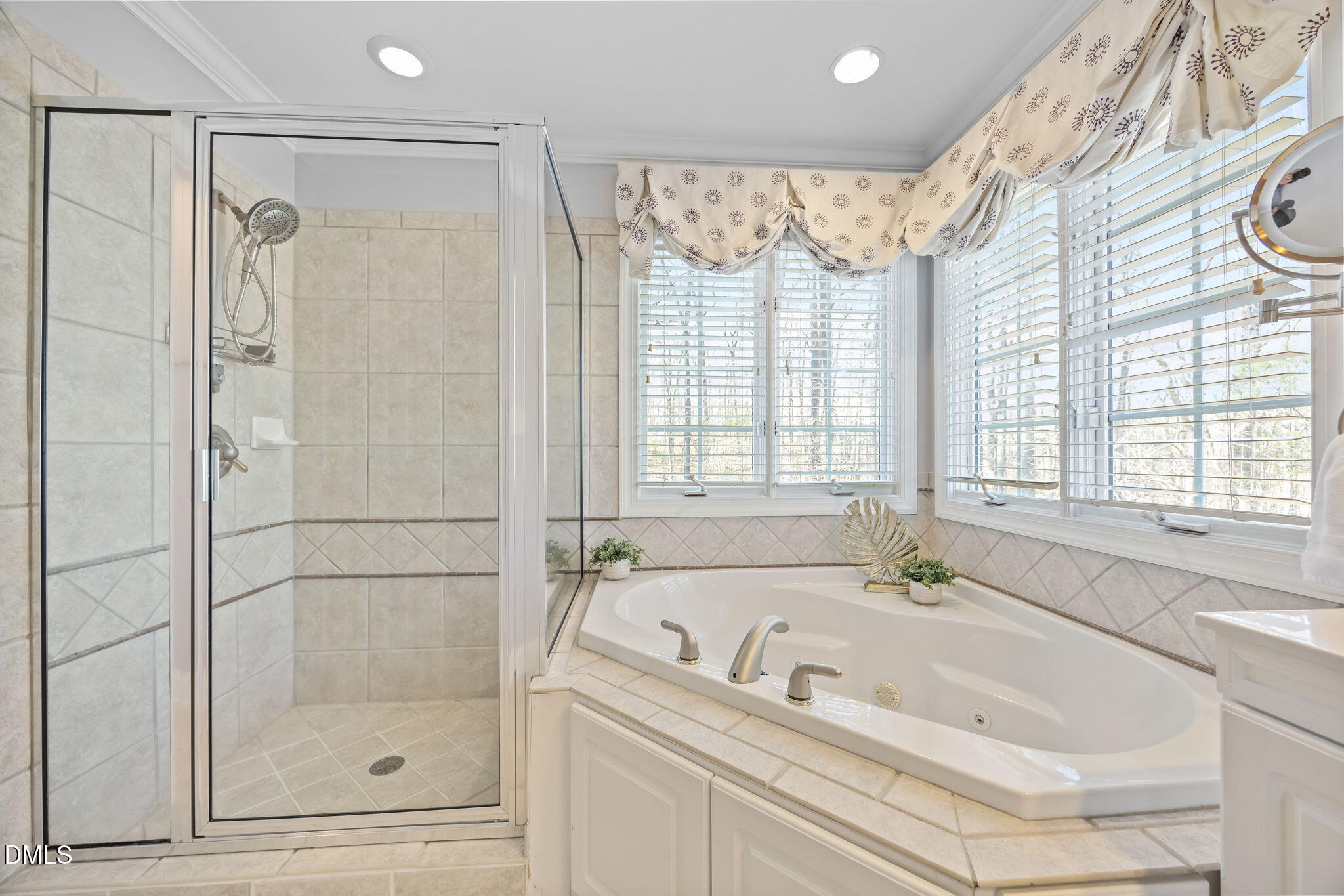 111 Lake Ridge Place Chapel Hill, NC 27516 - Photo 56 of 84 a bathroom with a tub a sink and a shower